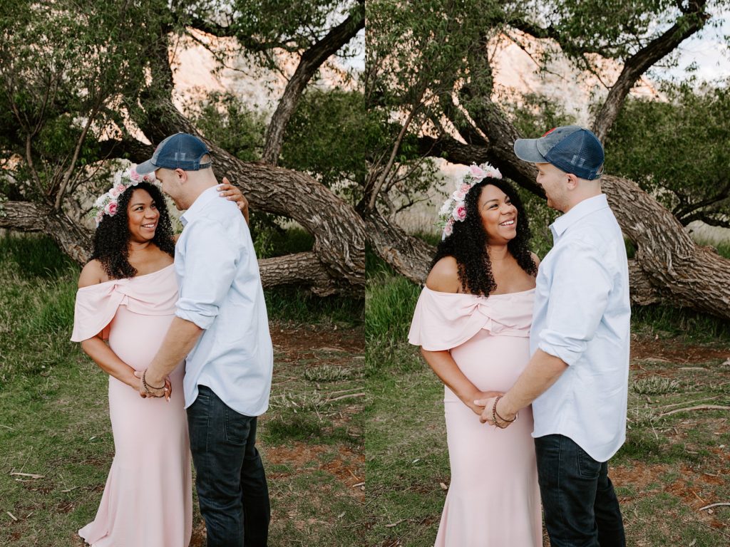 Laughing couple during golden hour maternity session in Colorado Springs 