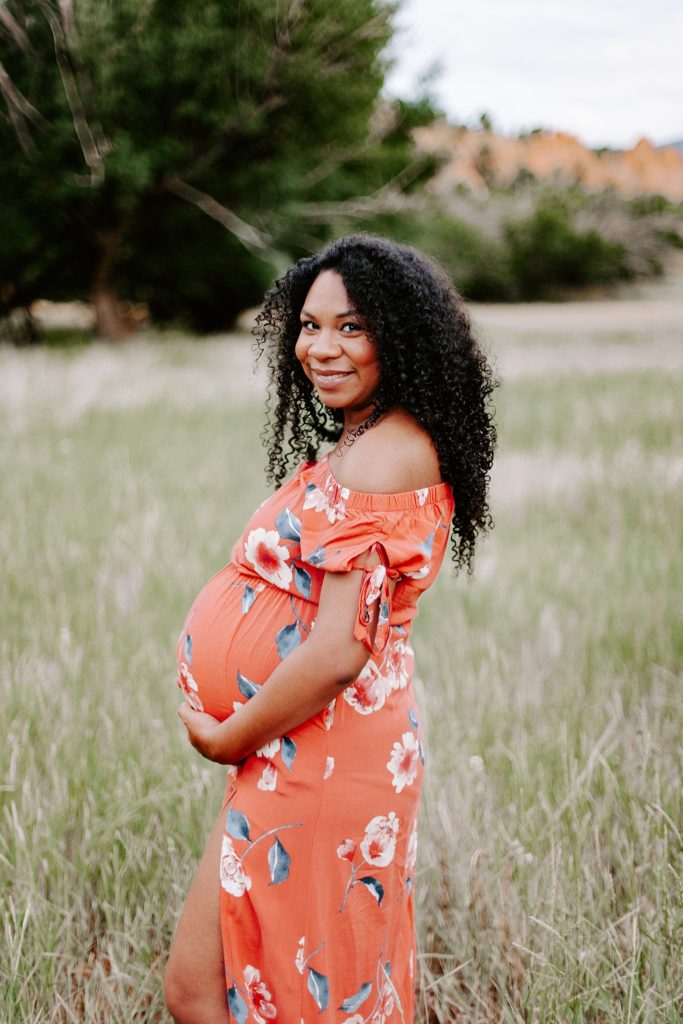 Beautiful woman of color posing for maternity session 